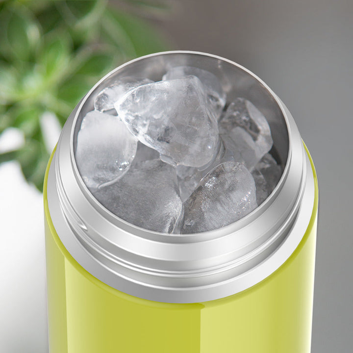 Thermos® 12oz FUNtainer® water bottle in Yellow/Green — shown filled with ice, demonstrating insulation