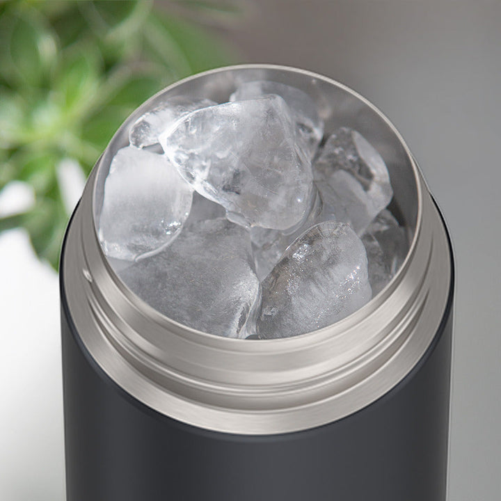 Thermos® 16oz FUNtainer® water bottle in Rosewood — shown filled with ice, demonstrating insulation