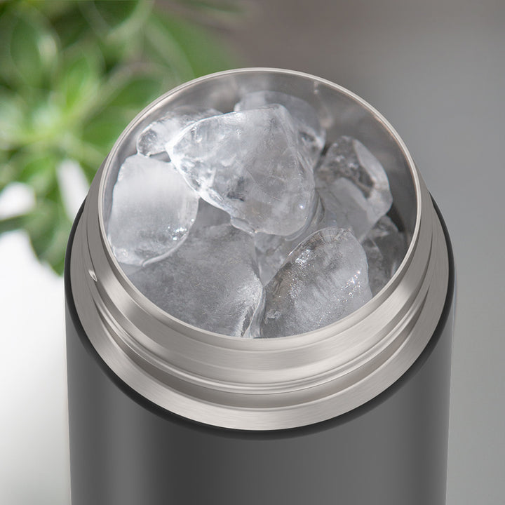 Thermos® 16oz FUNtainer® water bottle in Lightning Bolt Girl — shown filled with ice, demonstrating insulation